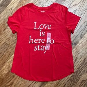 red tee with words